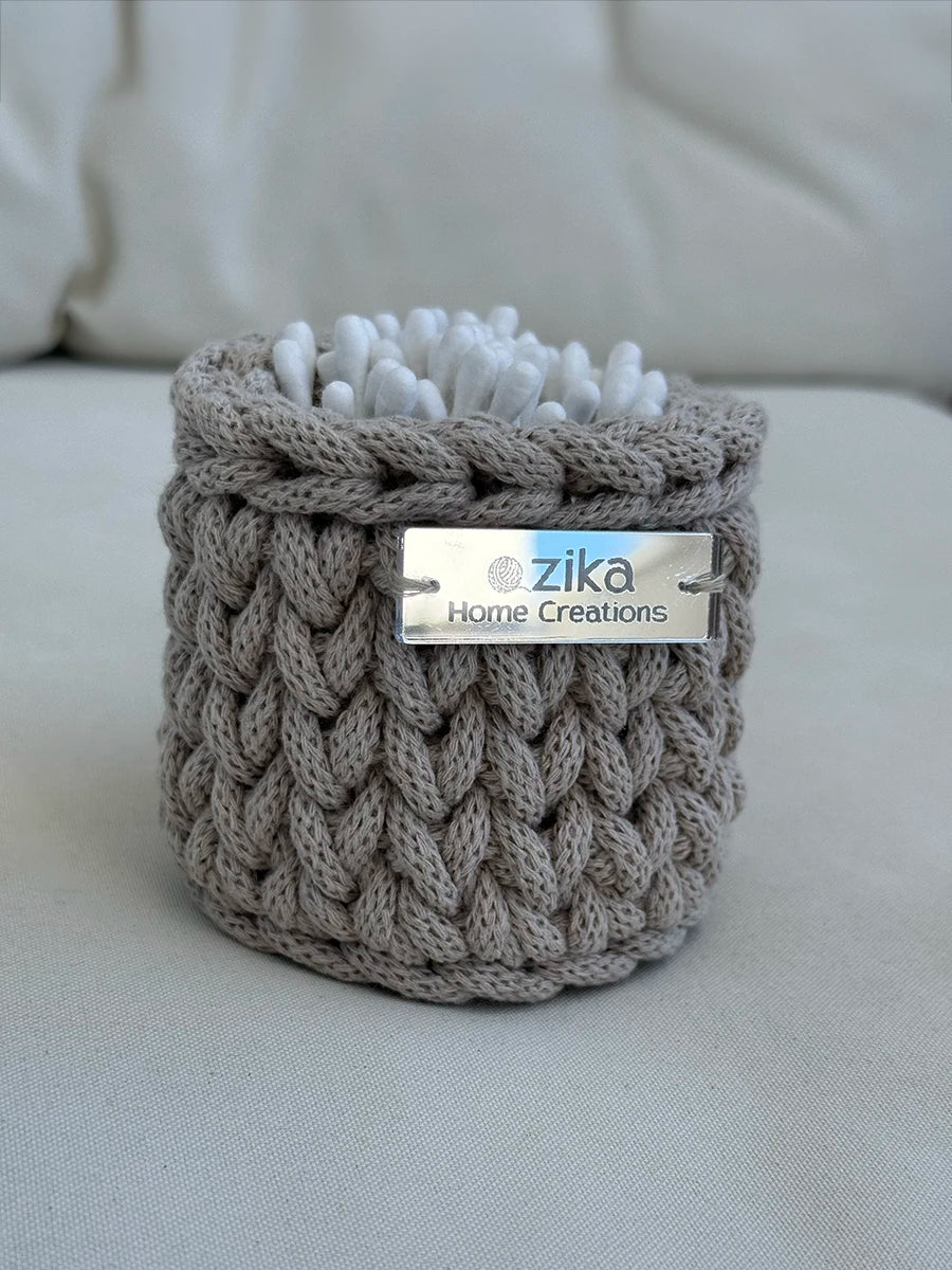 Mini Little Loop handmade recycled cotton basket in beige holding cotton buds by Zika Home Creations